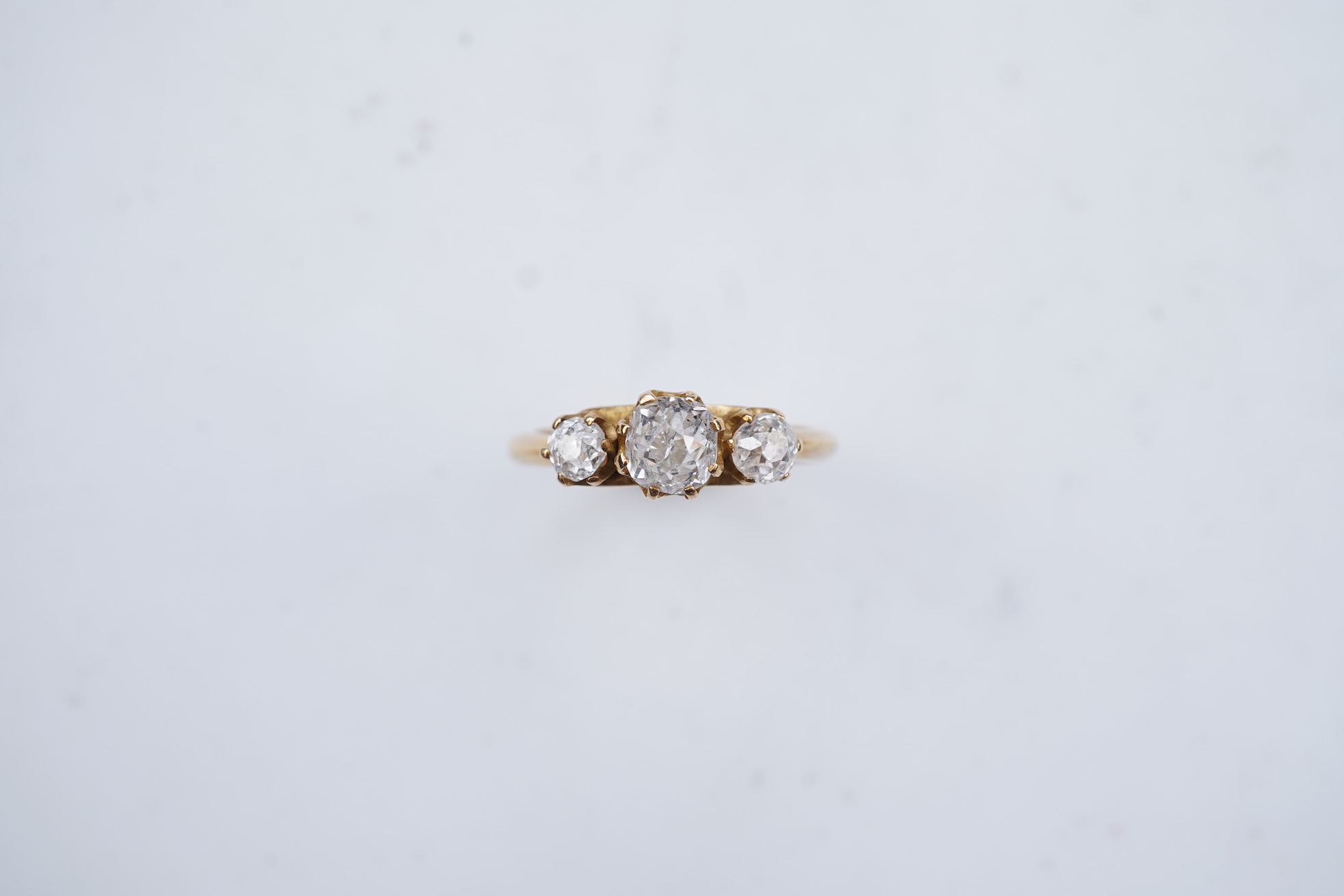 A three-stone diamond ring, early 20th century